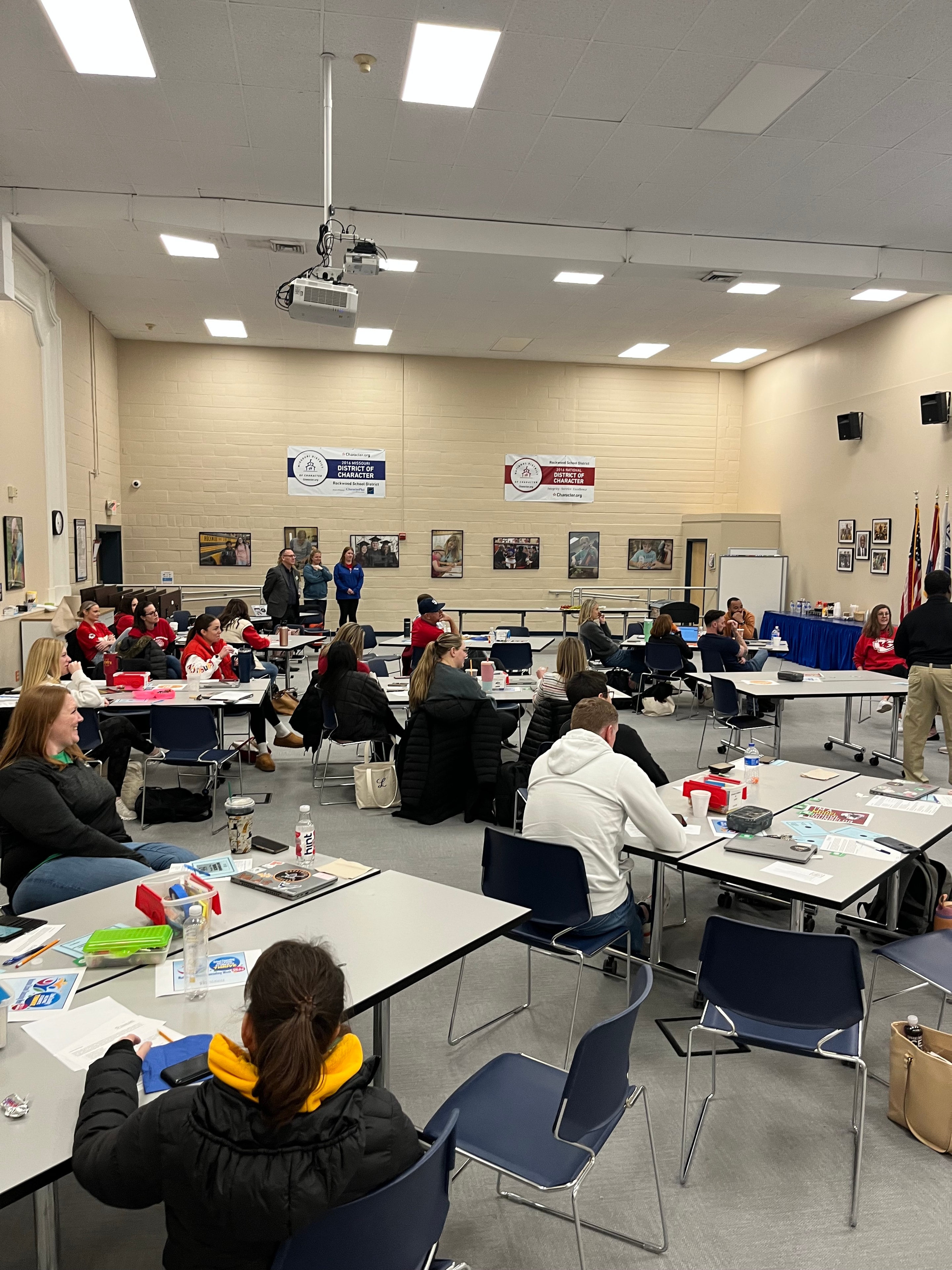 Community members attending a presentation in a classroom setting