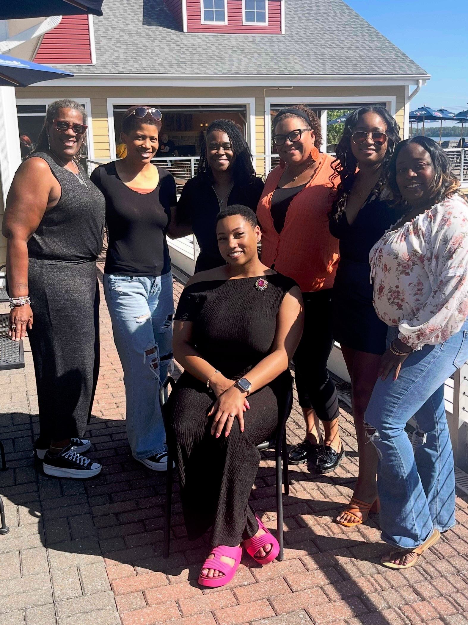 Changes Therapeutic Services team members gathered outdoors on a sunny day