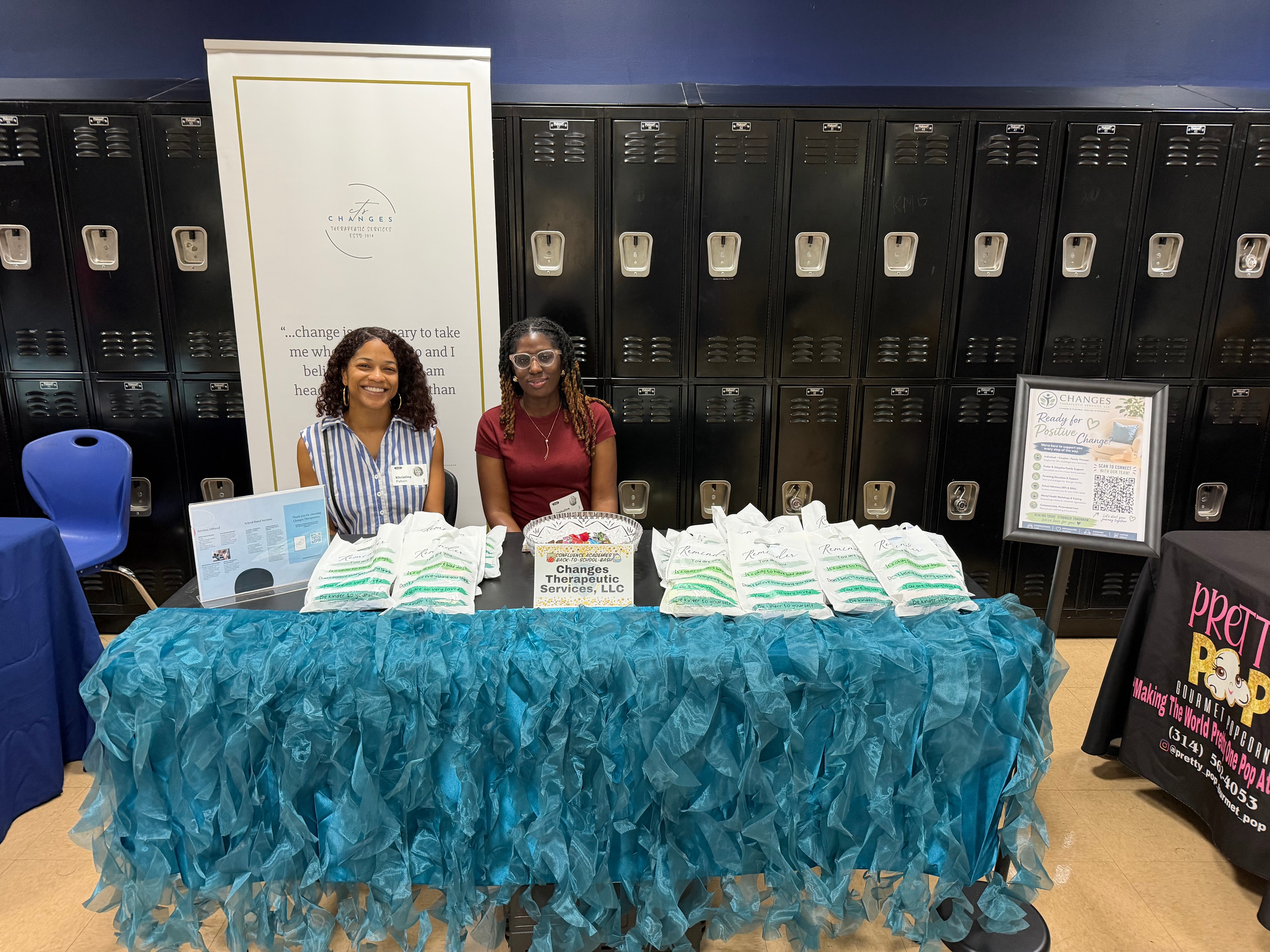 Changes Therapeutic Services team hosting a resource booth at a school community event