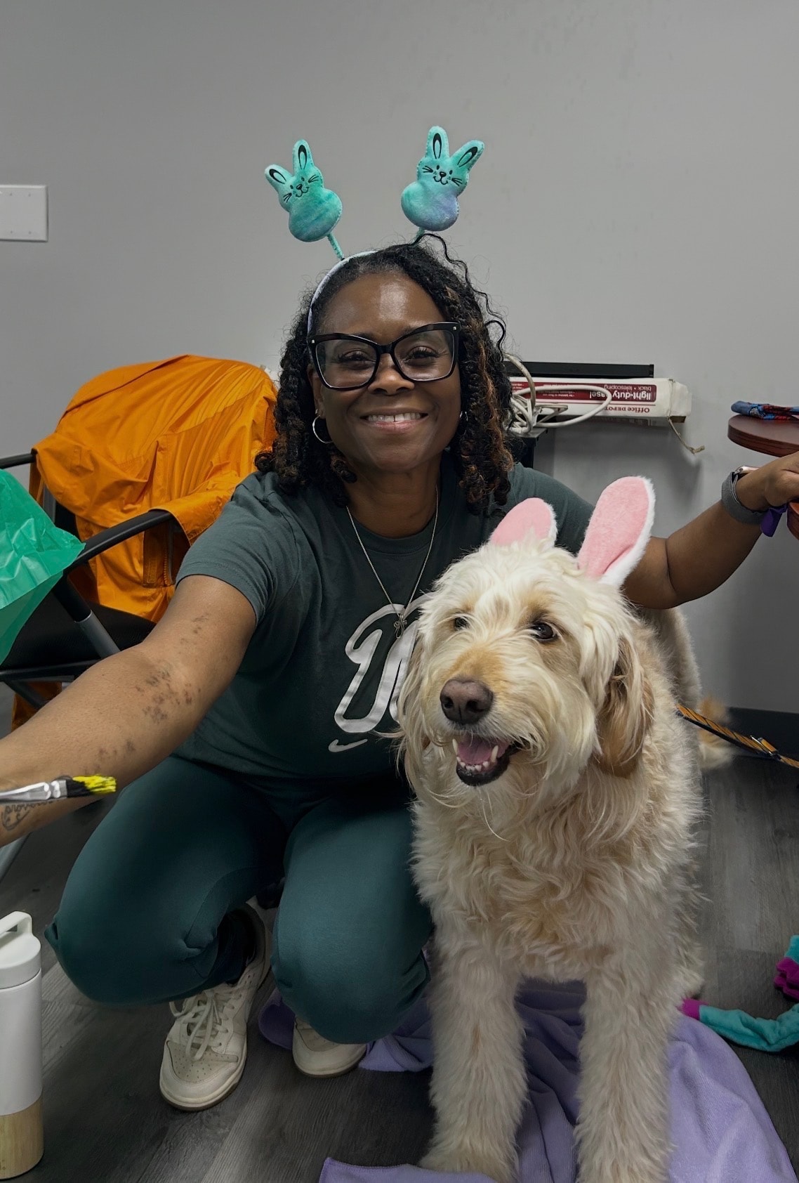 Changes Therapeutic Services team member smiling with a therapy dog during a visit