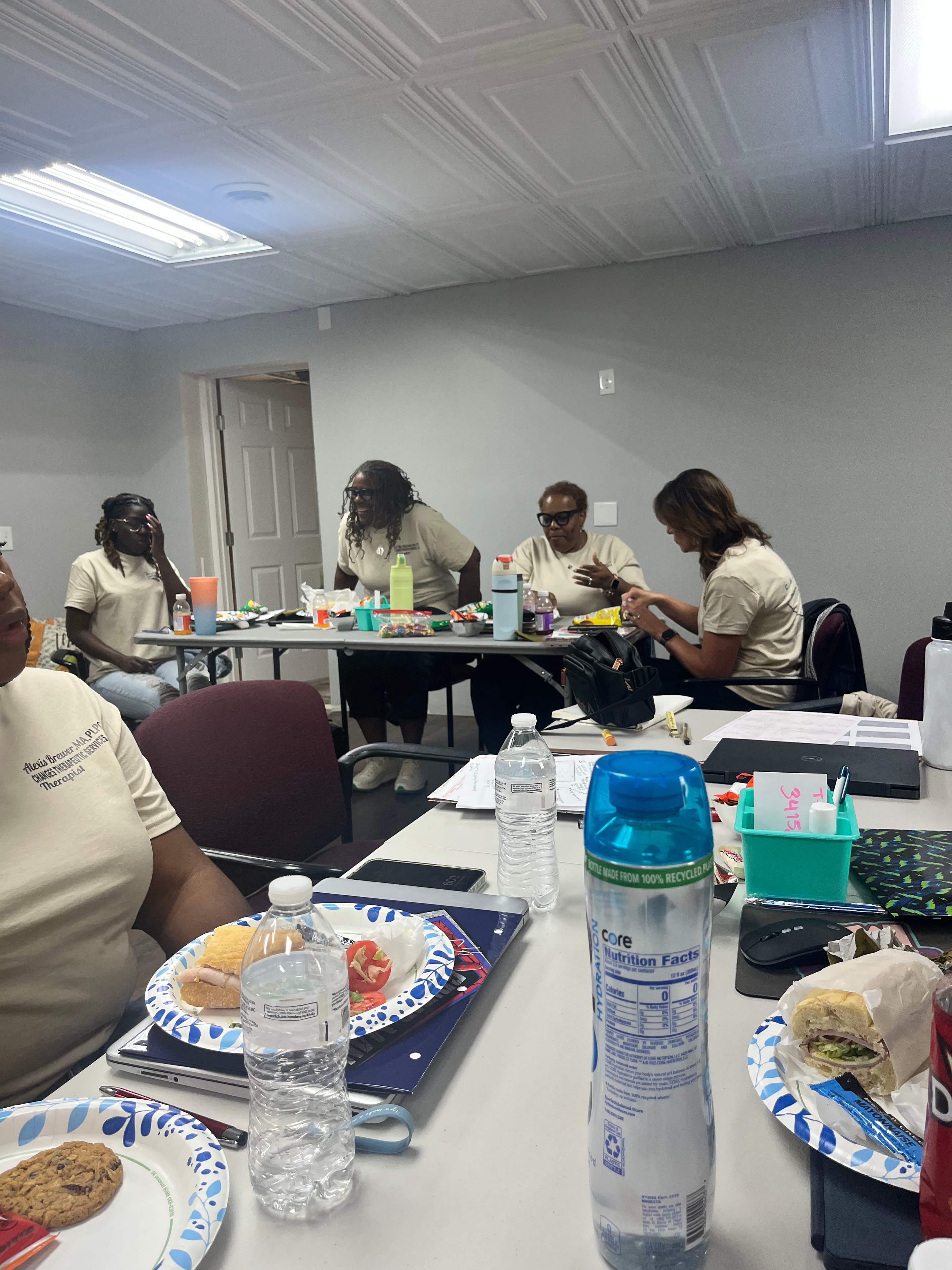 Changes Therapeutic Services team members sharing a meal during an event