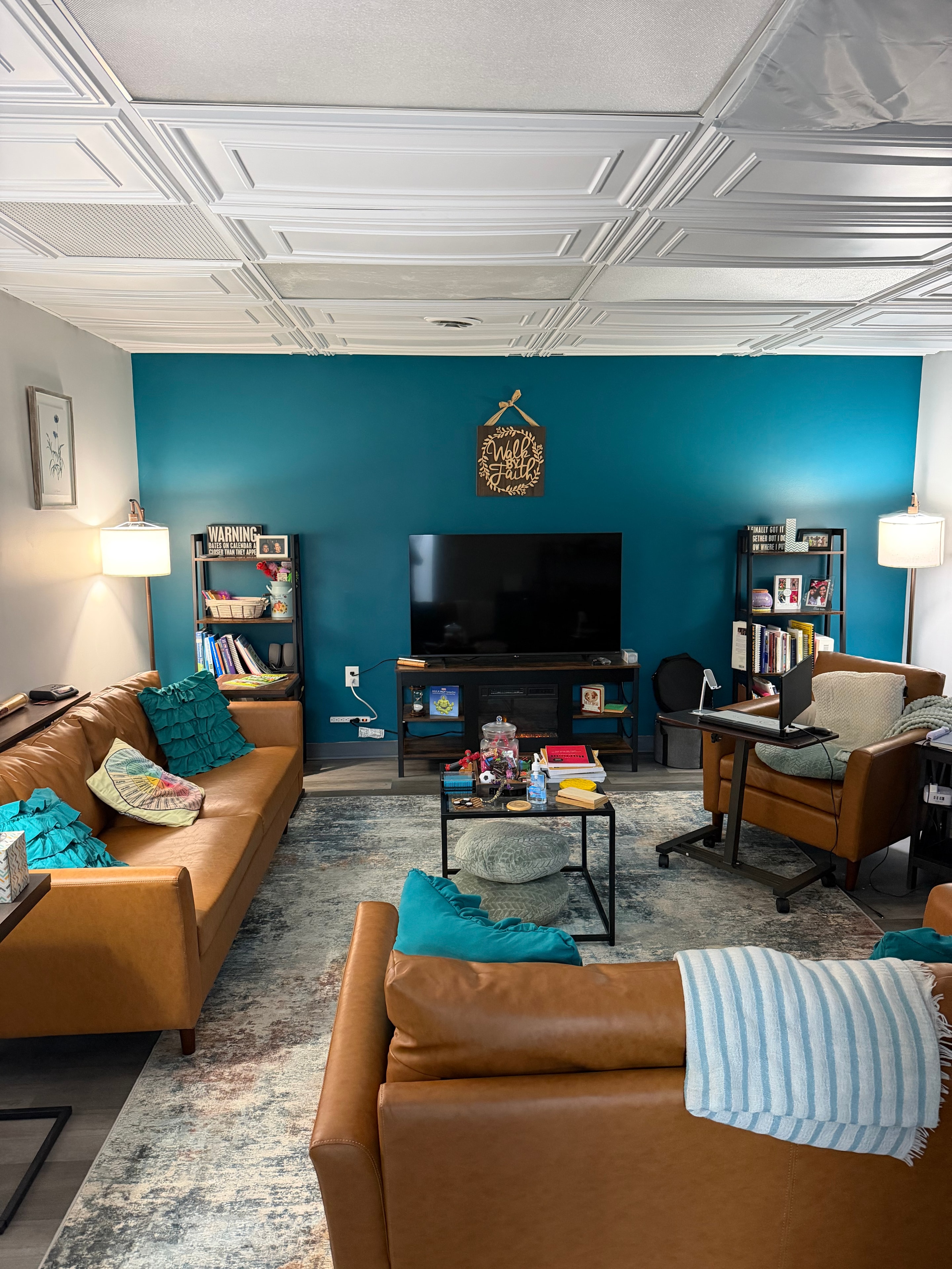 Dr. Linda Peterson's office — teal accent wall with leather seating