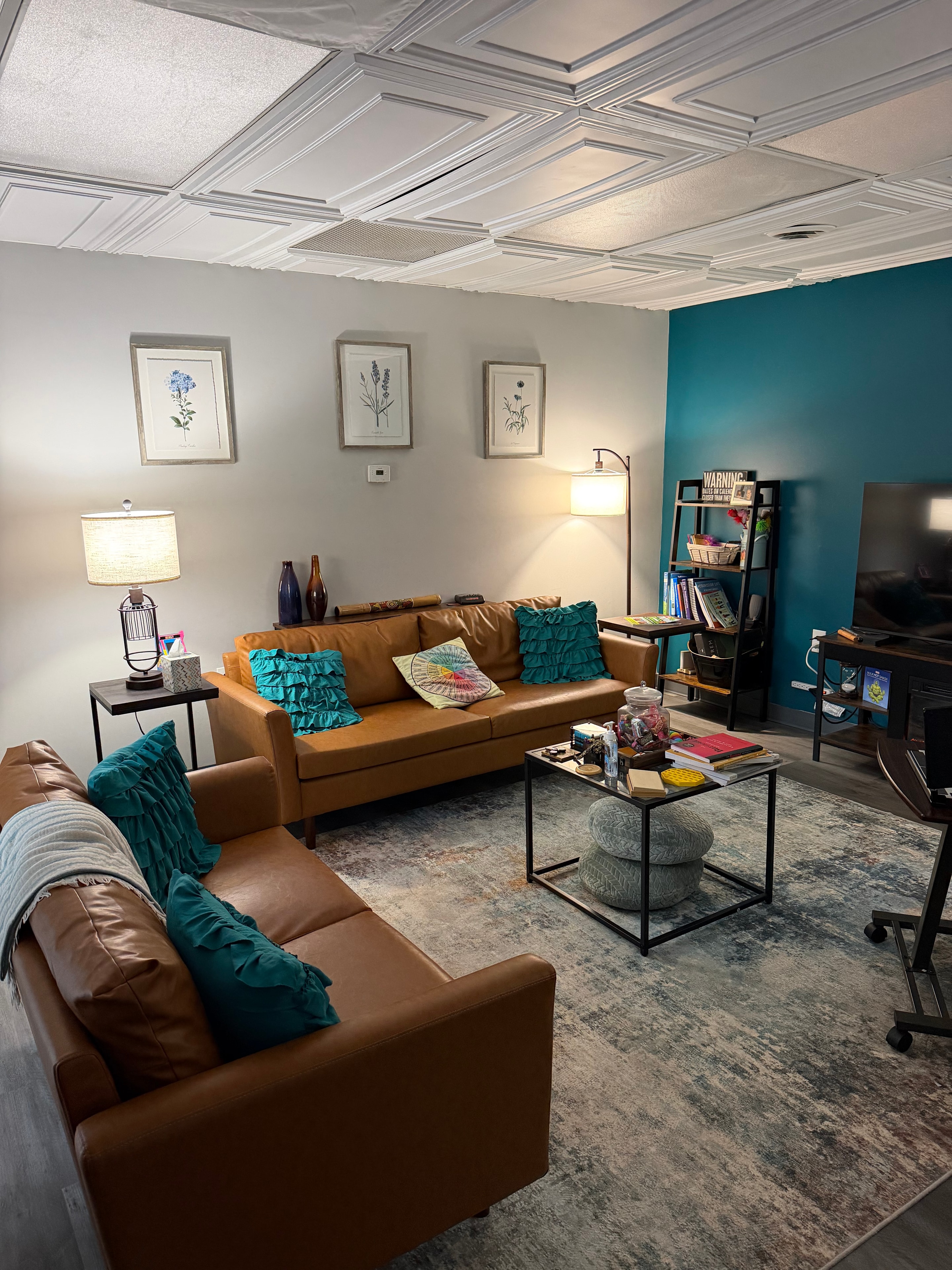 Dr. Linda Peterson's office — botanical art and warm seating area